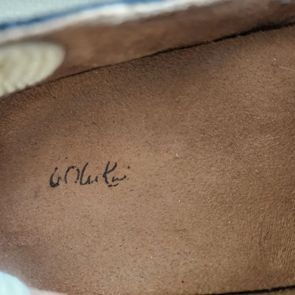 OluKai Black and White Flats Sleek Slip-On Design